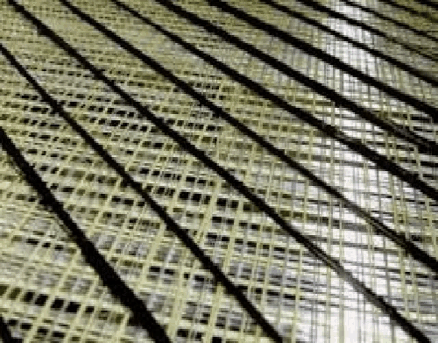 a close up of a wicker mat with a pattern of lines and squares .