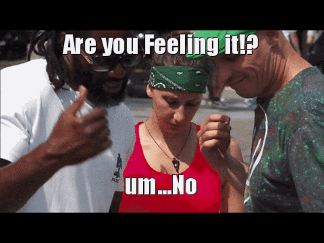 a woman wearing a green bandana and a red tank top is being asked if she 's feeling it