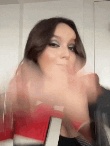a blurry picture of a woman 's face and hands