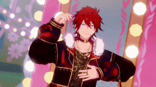 a man with red hair is standing in front of a mirror with lights behind him