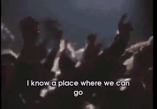 a man singing into a microphone with the words " i know a place where we can go " next to him