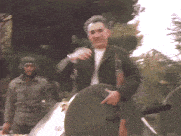 a blurry picture of a man holding a shield and pointing