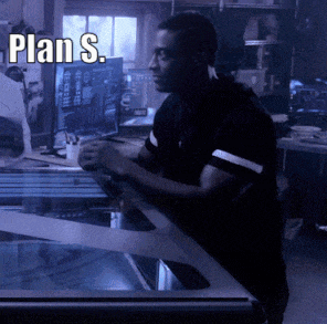 a man stands in front of a computer screen with the words plan s. written above him