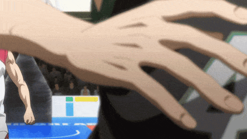 a person 's hand is reaching out towards another person 's hand in a blurry photo