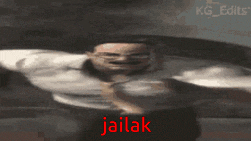 a blurry image of a person with the word jailak written in red