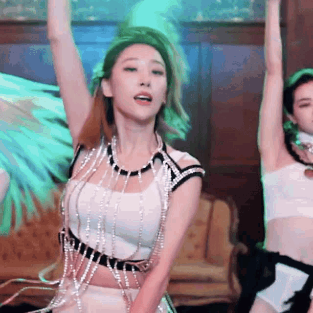 a woman in a white crop top is dancing