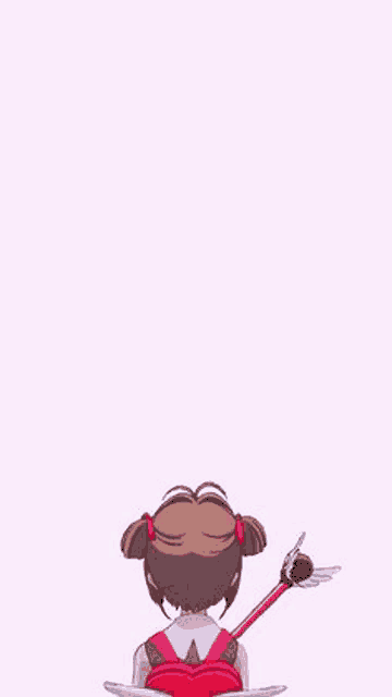 a little girl is holding a wand in her hand and looking at the camera on a pink background .