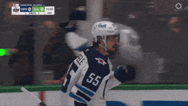 a hockey player wearing a number 55 jersey