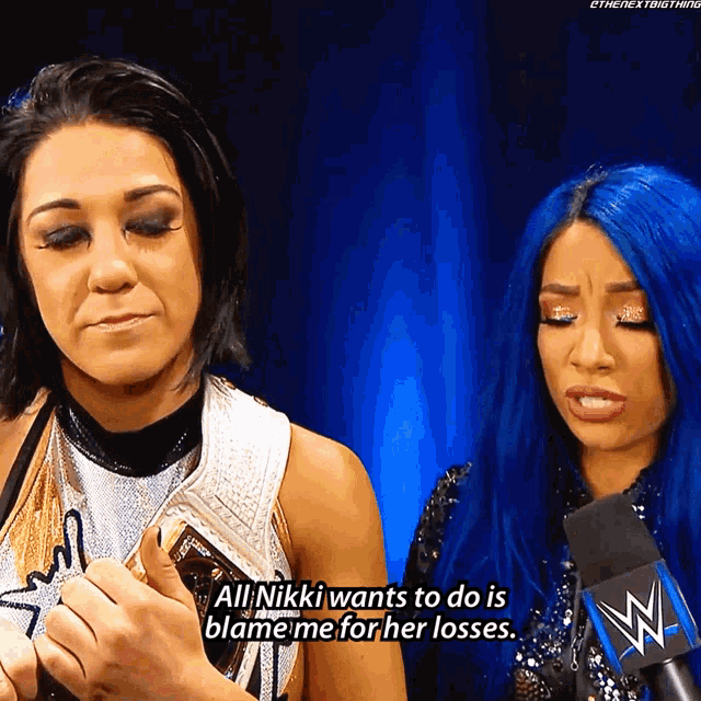 a woman with blue hair says that nikki wants to do is blame her for her losses
