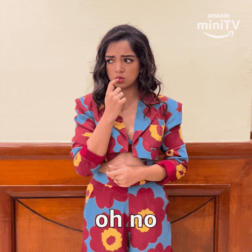 a woman in a floral outfit says oh no in front of an amazon minitv logo