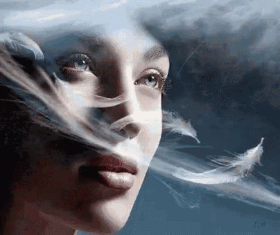 a close up of a woman 's face with feathers coming out of her eyes .