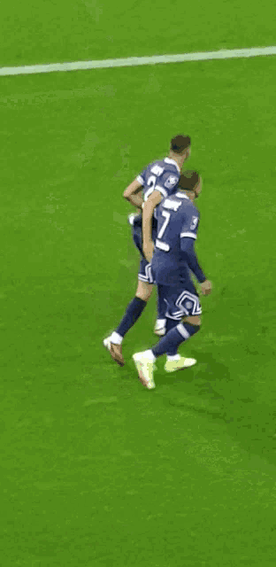 a soccer player with the number 21 on his jersey is running on the field