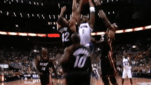 a basketball player with the number 10 on his jersey is jumping in the air