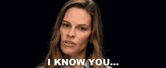 a woman says " i know you " in a black background