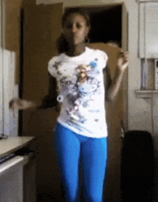 a girl in a white shirt and blue pants is dancing