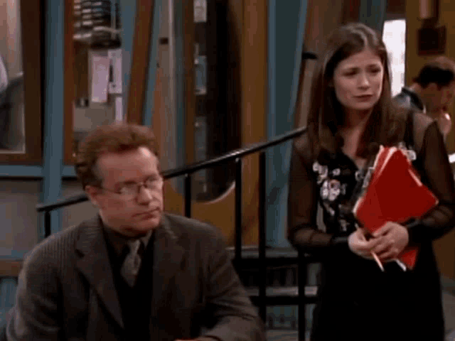 a man and a woman standing next to each other with the words overruled written on the screen
