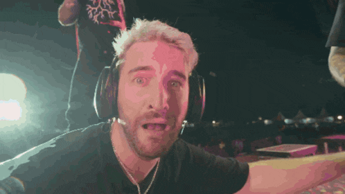 a man wearing headphones with a microphone on his head
