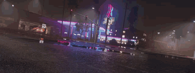 a blue car is driving down a wet street with the word welch written in white letters