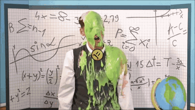a man with green slime on his face is standing in front of a board with math equations on it