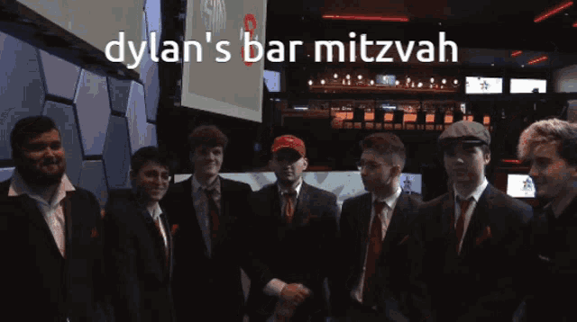 a group of men are posing for a picture with the caption " dylan 's bar mitzvah "