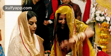 a group of women are dancing together in a room .