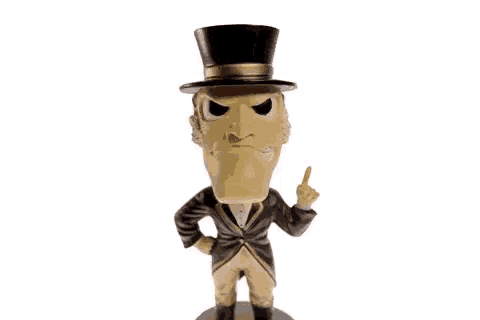 a figurine of a man wearing a top hat and a suit is pointing at the word foodrest