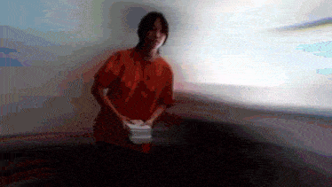 a blurry picture of a person holding a stack of papers