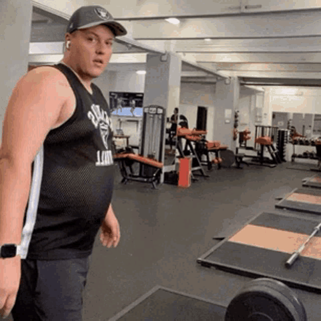 a man in a black tank top that says stack on it