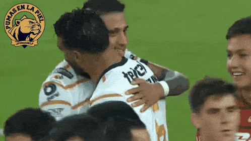 a pumas en la piel logo can be seen on a soccer field
