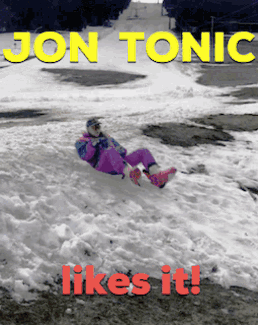 a picture of a person sliding down a snowy hill with the words " jon tonic likes it "