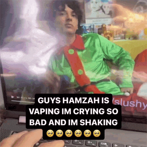 a person is using a laptop with a picture of a man on the screen