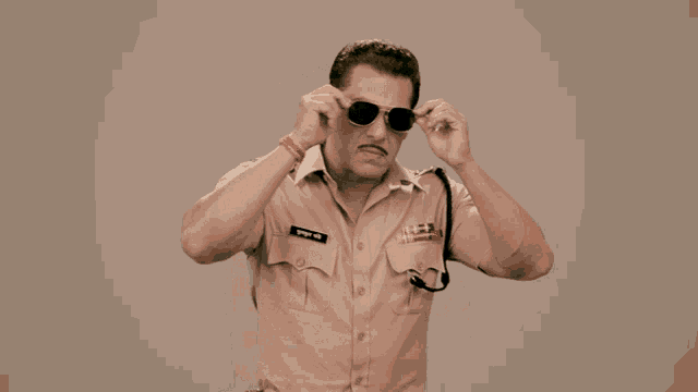 a man in a police uniform has a name tag that says ' salman khan ' on it