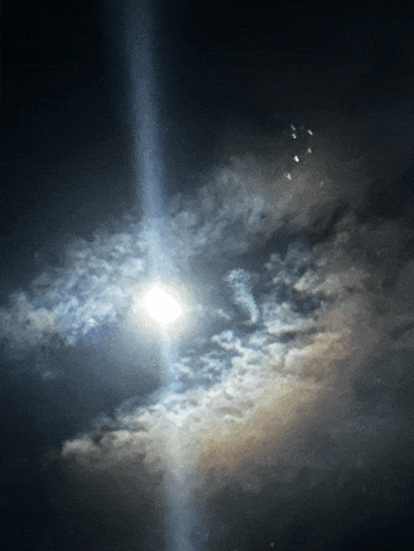 the sun is shining through the clouds in the dark sky