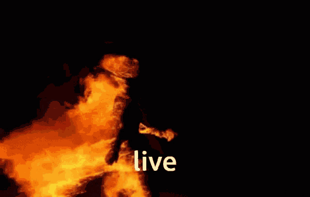 the word live is next to a large fire