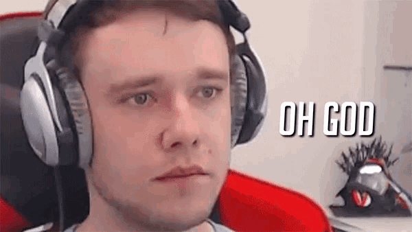 a man wearing headphones is making a funny face while sitting in a chair .