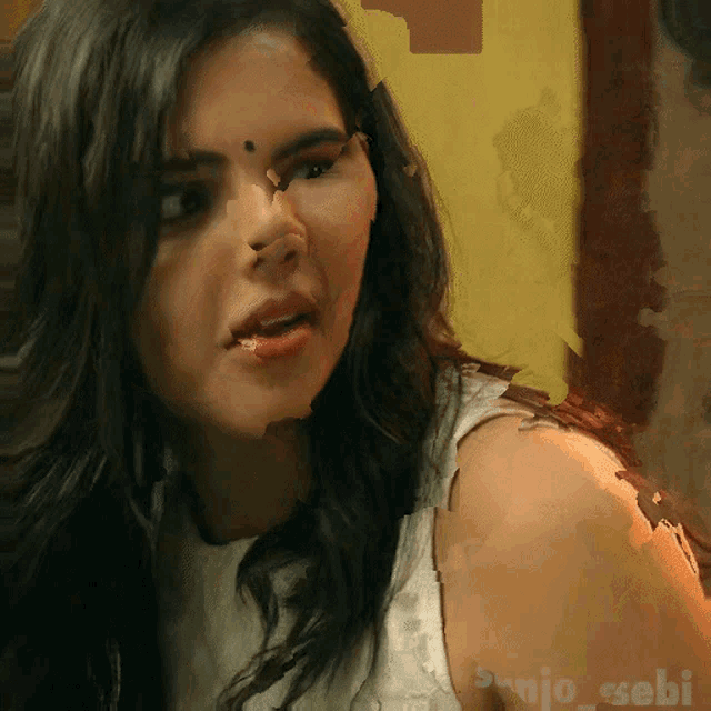 a close up of a woman 's face with the name sanjo-sebi on the bottom right