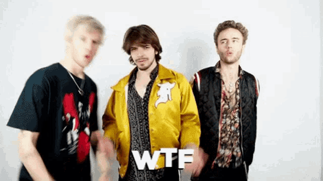 a group of young men are standing next to each other with the word wtf written on the bottom .