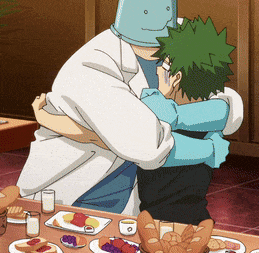 a man in a white coat is hugging another man with green hair