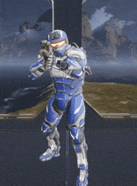 a man in a blue and white armor is holding a rifle