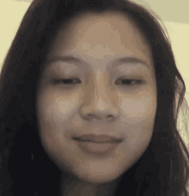 a close up of a woman 's face without makeup