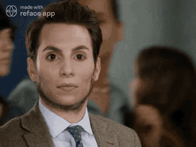 a man in a suit and tie is being made with the reface app