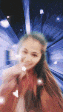 a blurry picture of a woman 's face in a dark room