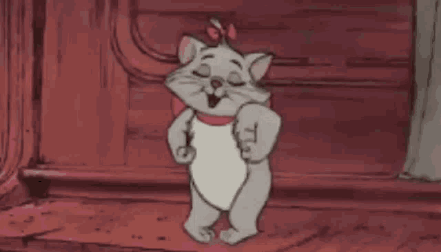marie from the aristocats is standing on a wooden floor .