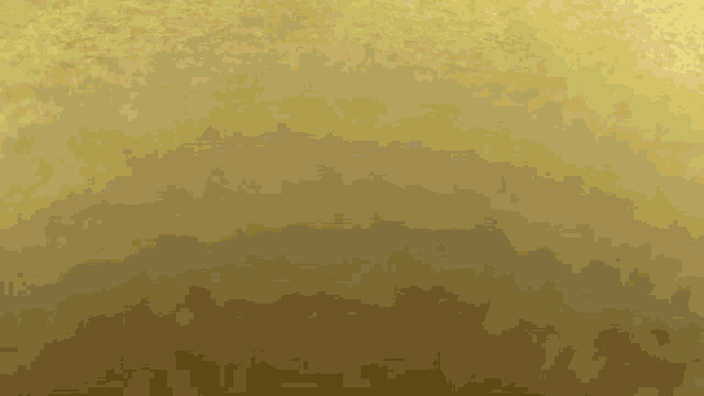 gold glitter is falling on a gold background