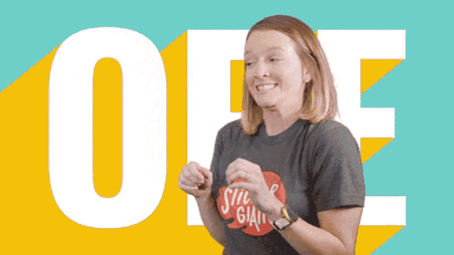 a woman wearing a shirt that says sticker giant on it