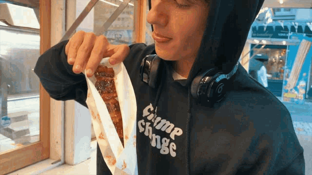a man wearing a hoodie that says crime change