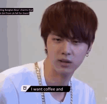 a young man is wearing a white shirt and a gold chain around his neck and says i want coffee and