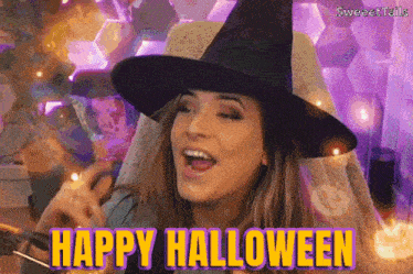 a woman is wearing a witch hat and says happy halloween