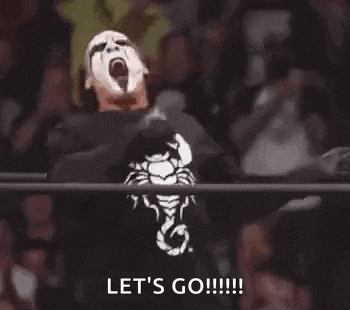 a man in a wrestling ring with a scorpion on his shirt is screaming .