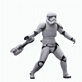 a stormtrooper from star wars is holding a sword in his hand .